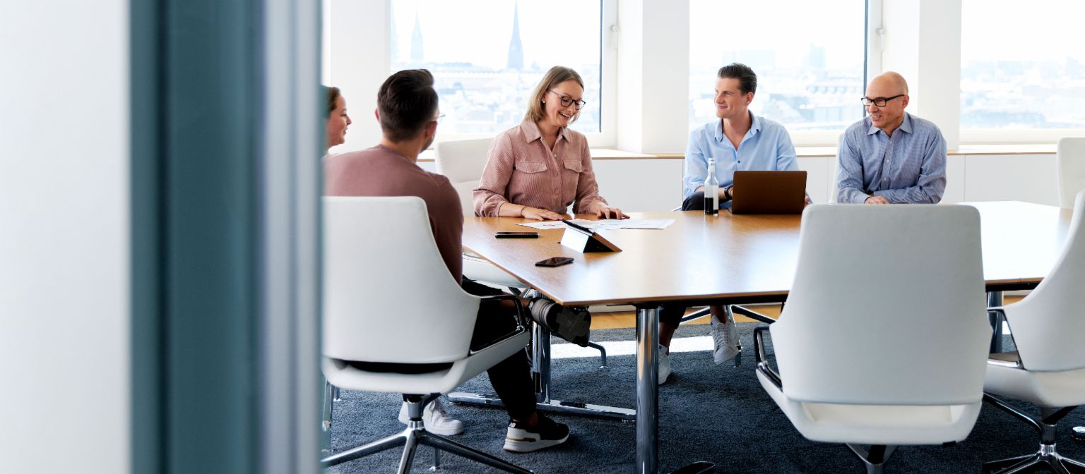 Group of EOS employees having a meeting