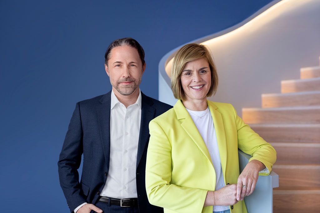 The image shows Marwin Ramcke, CEO of the EOS Group, and Dr. Eva Griewel, CFO of the EOS Group, together.
